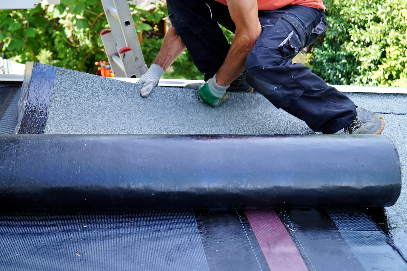 contractor installing roofing materials